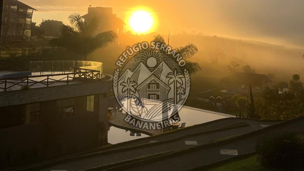 a sign for the grand entrance to a building at sunset at Refúgio Serrano Bananeiras in Bananeiras