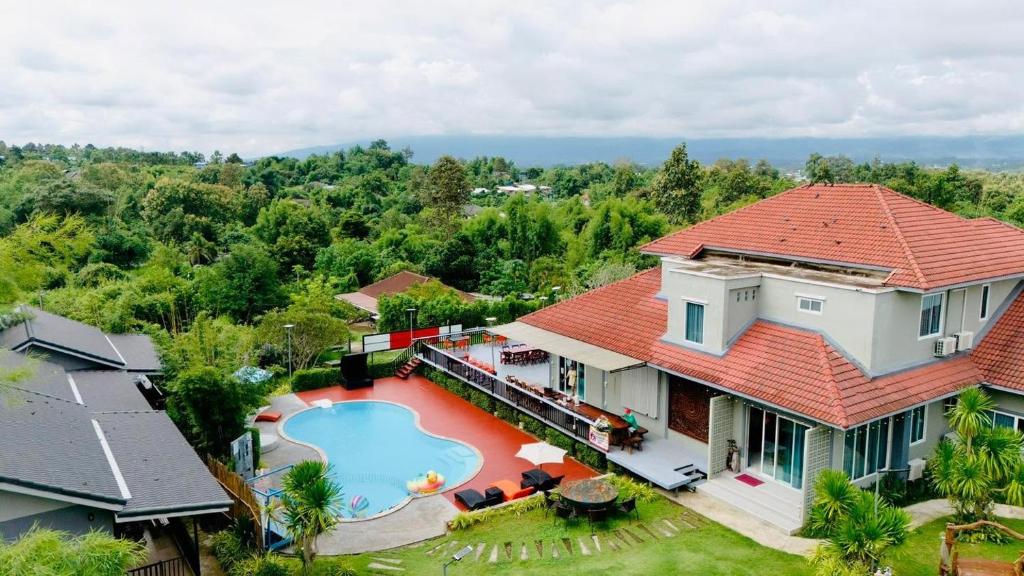 an aerial view of a house with a swimming pool at Lebest Pool Villa Chiang Mai in Ban Mai