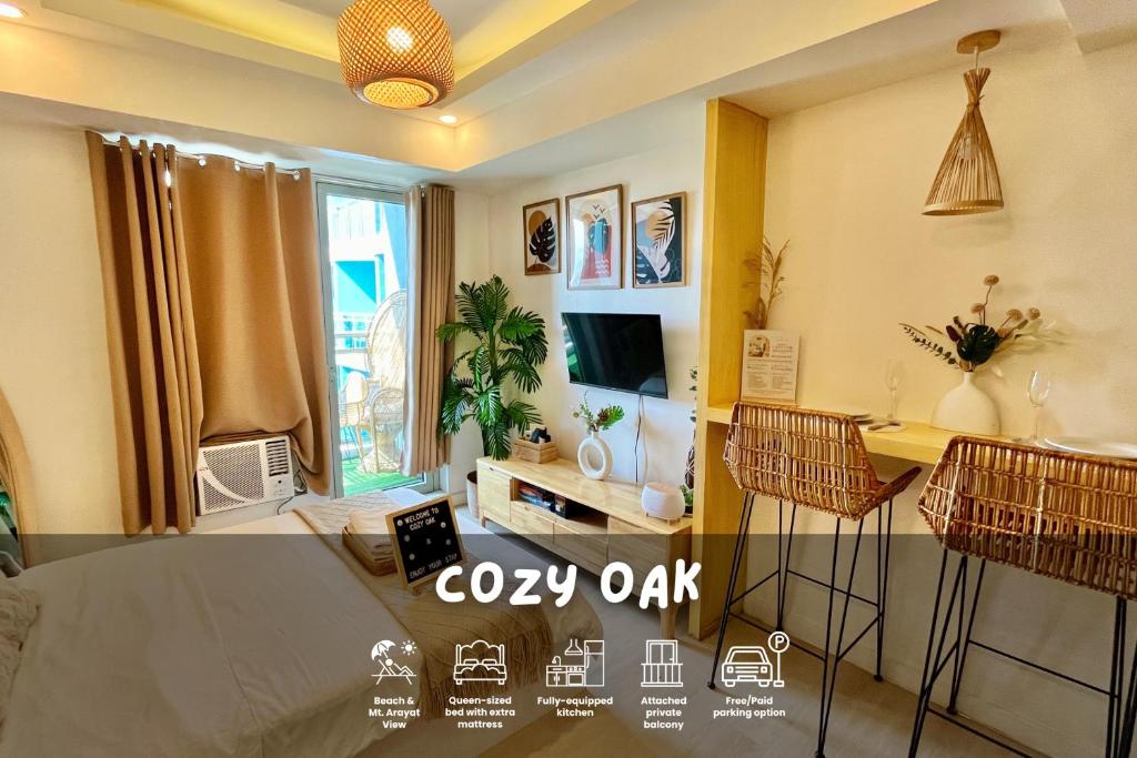 a living room with a bed and a table and chairs at Cozy Oak - Boho Studio for Couples with Huge Balcony in San Fernando