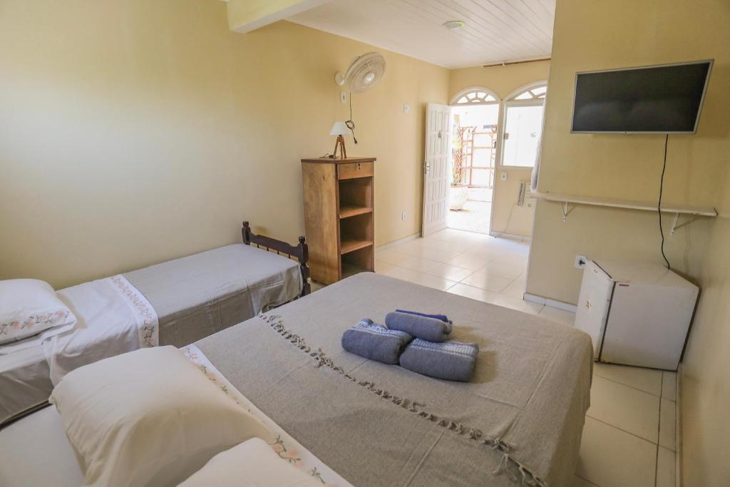 Postel nebo postele na pokoji v ubytování Casa Maju Suítes