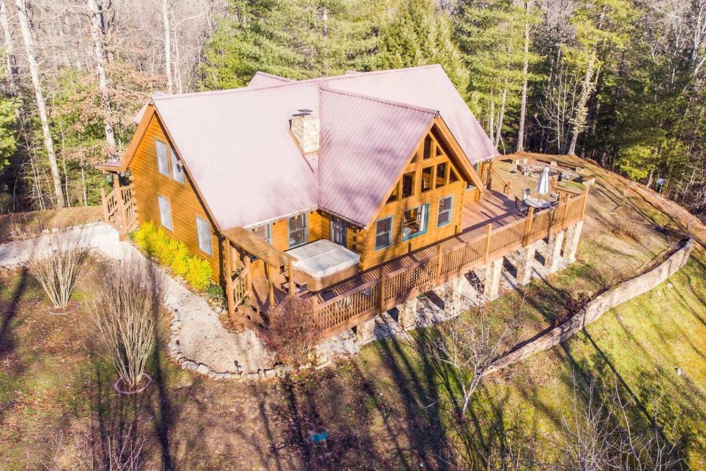 an aerial view of a log home with a roof at Hot Tub - Mill Creek Point - Red River Gorge KY in Rogers
