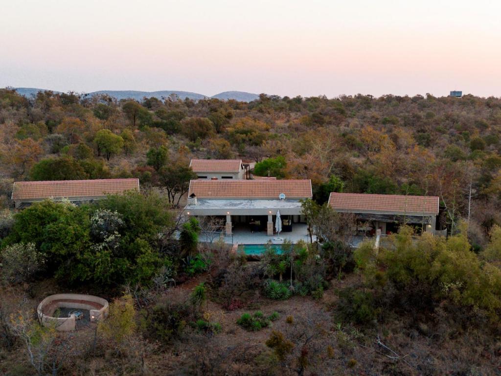 an aerial view of a house in the woods at Elements Bush Villa 295 in Mabula