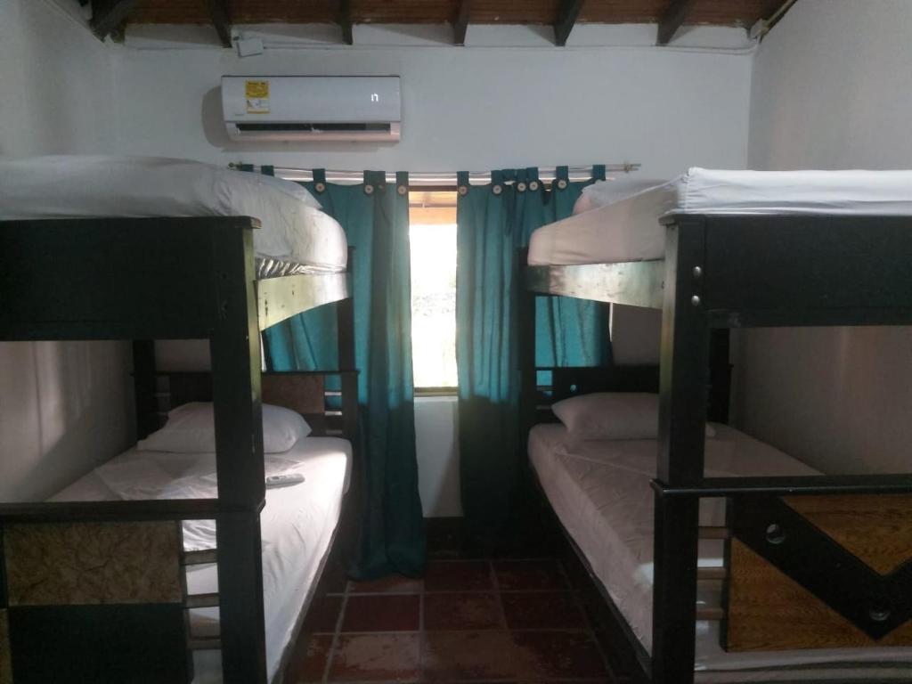 Giường trong phòng chung tại Cabaña Espolon