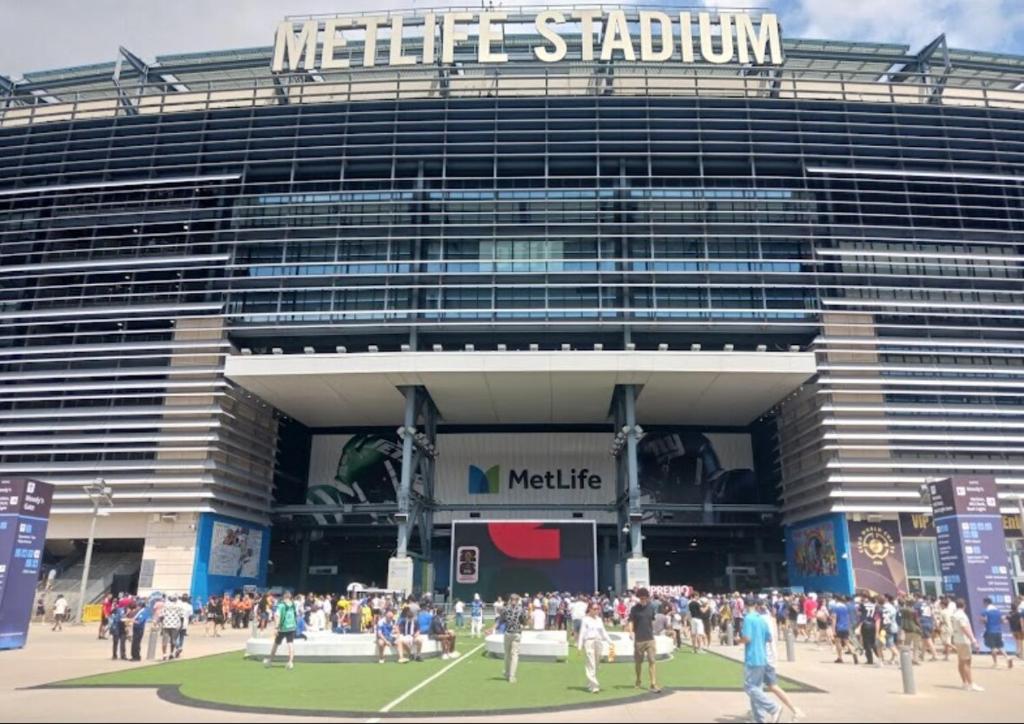 a crowd of people standing outside of a stadium at Cozy Retreat Near EWR with NYC access in Newark