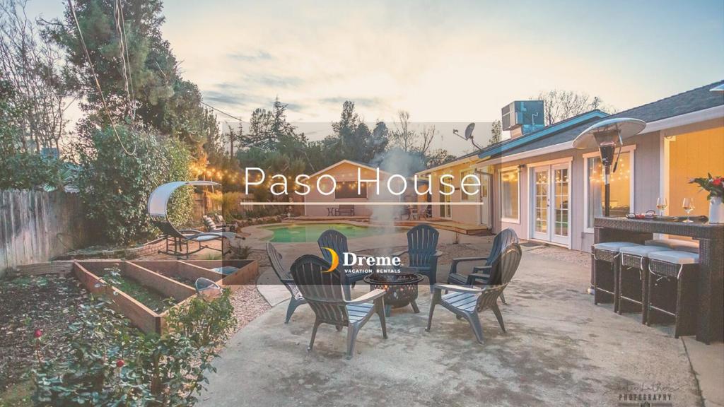 a patio with a table and chairs in a backyard at Paso House in Redding