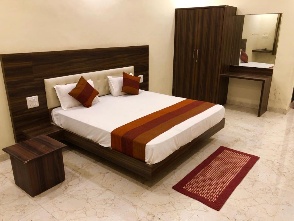 En eller flere senge i et værelse på Hotel Green valley resort