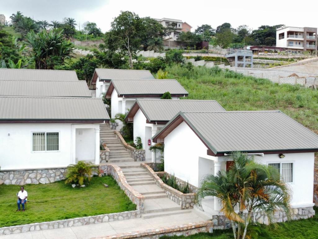 a row of houses in a village at Mar Luther Inn in Aburi