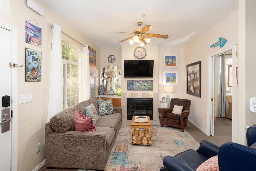 a living room with a couch and a fireplace at Tide & Treasures in Oceano