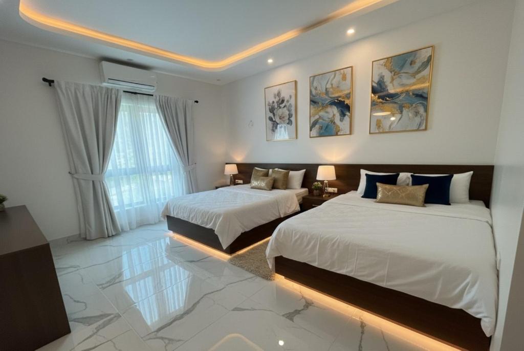 Ένα ή περισσότερα κρεβάτια σε δωμάτιο στο Tea hotel by Chiến Hảo