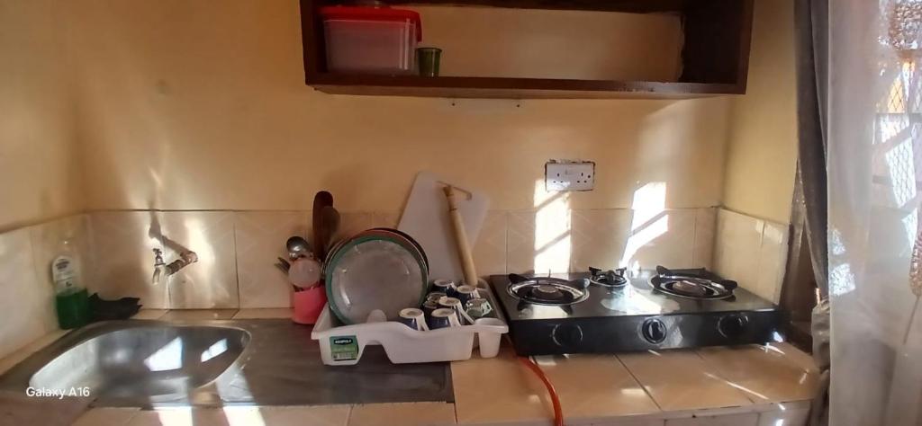 a toy kitchen with a sink and a stove at Smooth Landing in Ukunda