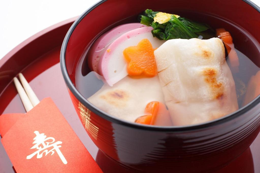 a red cup of soup with vegetables and carrots at SPRINGS VILLAGE Ashigara Tanzawa Onsen Resort & Gl - Vacation STAY 41913v in Hata