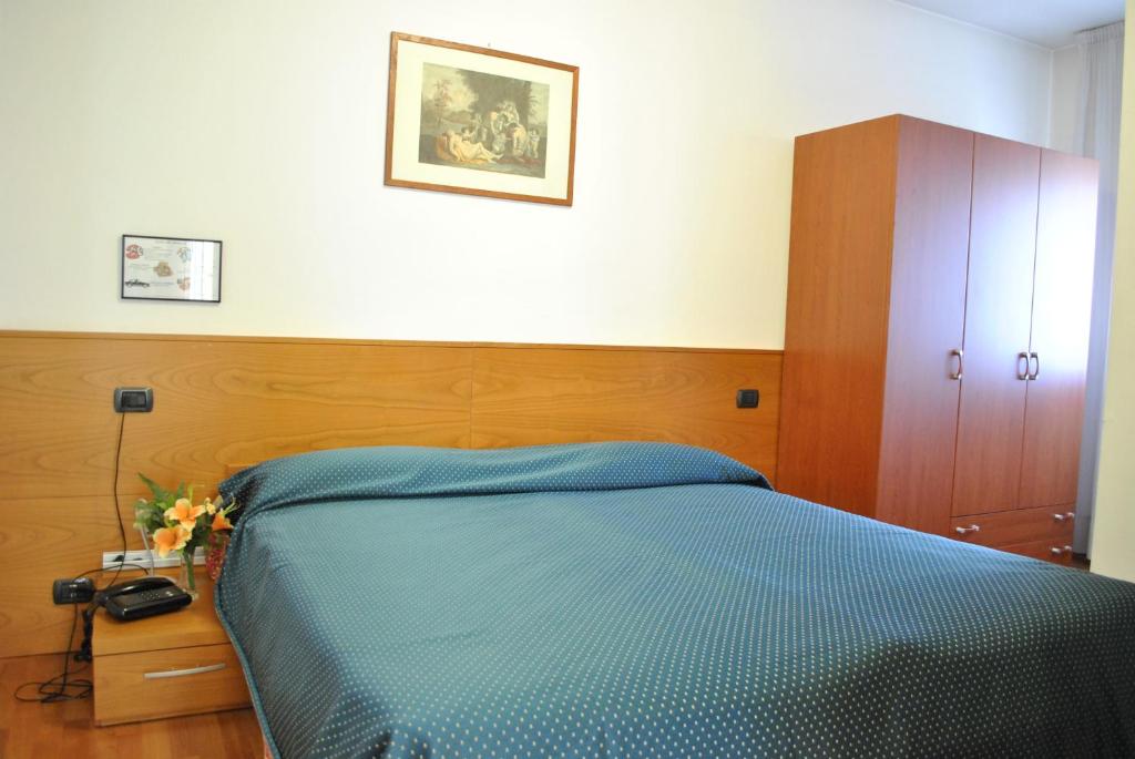 Postel nebo postele na pokoji v ubytování Rometta Hotel