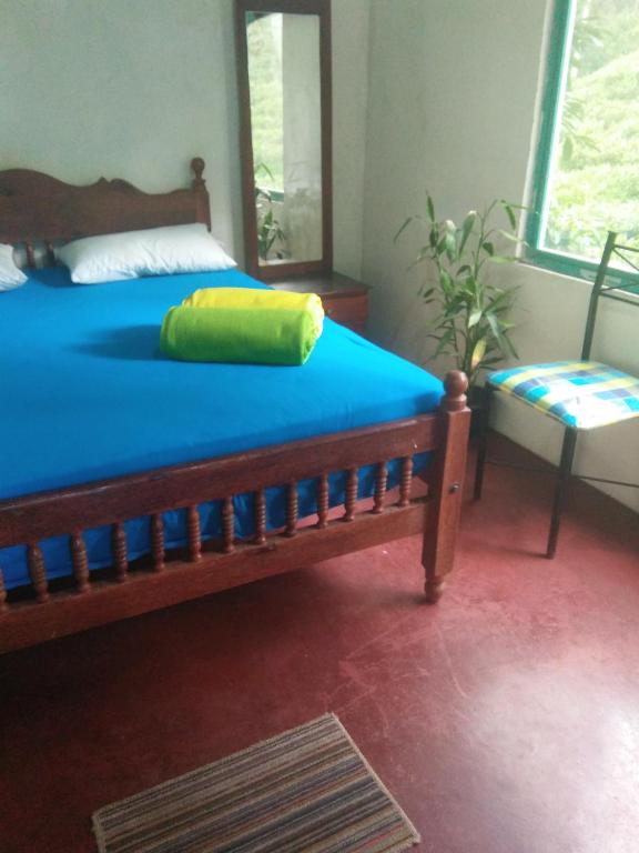 Postel nebo postele na pokoji v ubytování Niwasa House