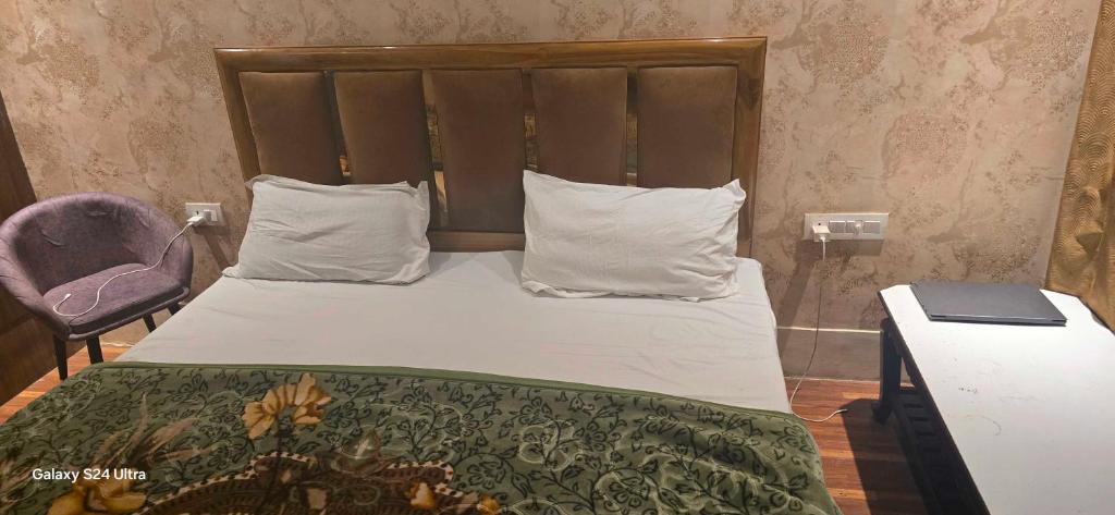 Postel nebo postele na pokoji v ubytování Hotel O Gangay