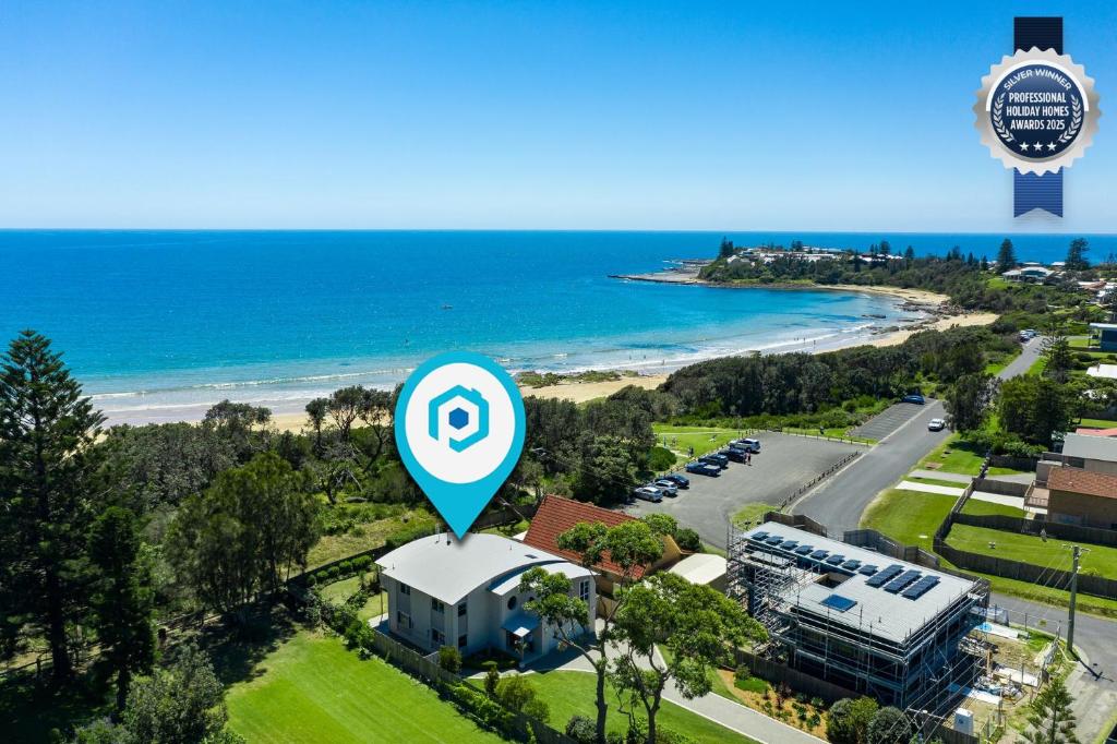 an aerial view of a beach with a parking lot at Nalu Pet Friendly 1 Min Walk to Beach in Culburra Beach