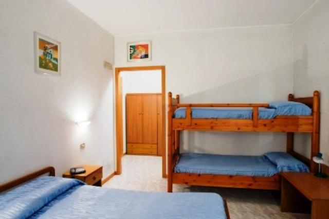 Postel nebo postele na pokoji v ubytování Albergo Ristorante Grigna