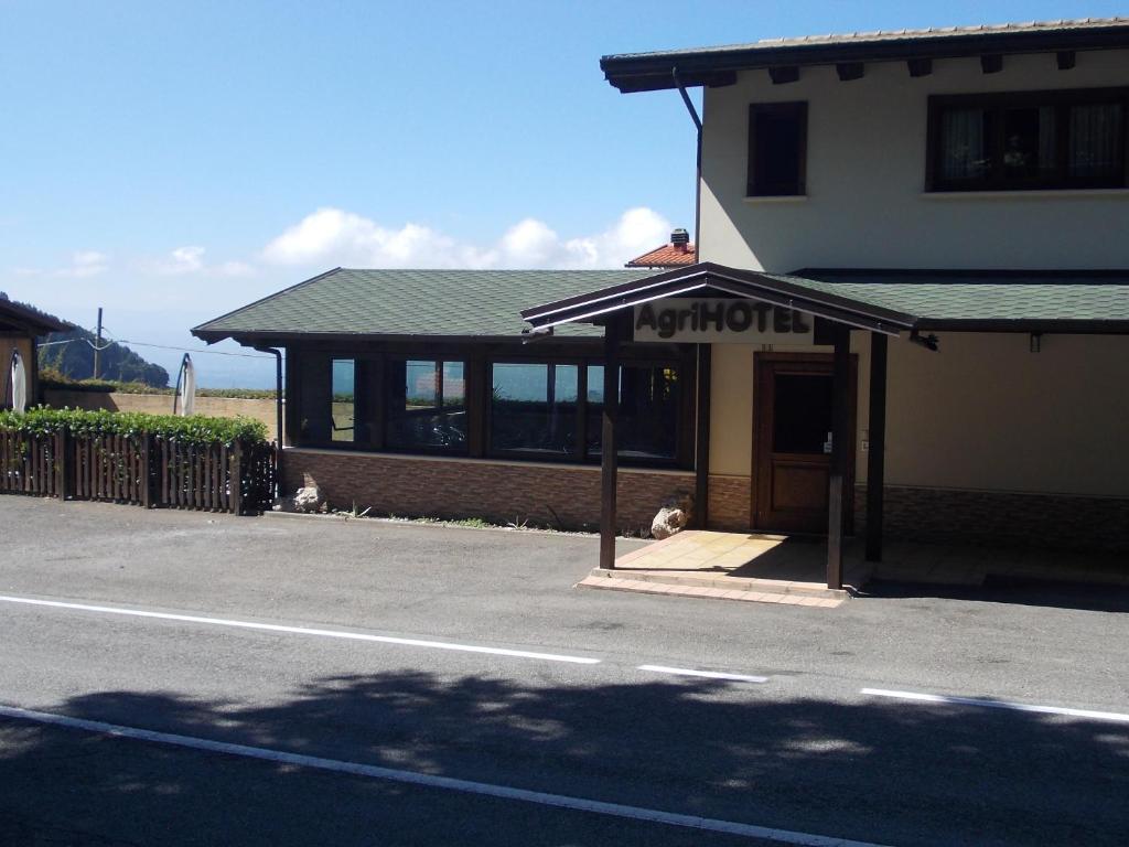 a building on the side of a street at AgriHotel Papaya in San Pietro Apostolo