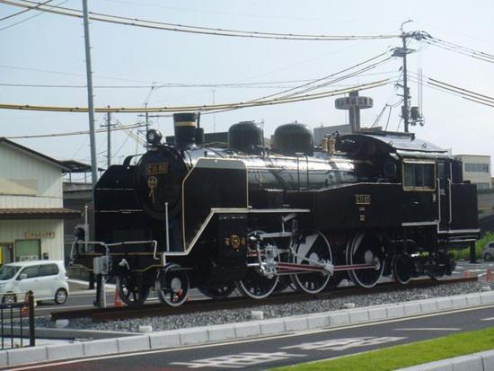 an old black train is on the tracks at Hotel Sun tsuyama in Tuyama