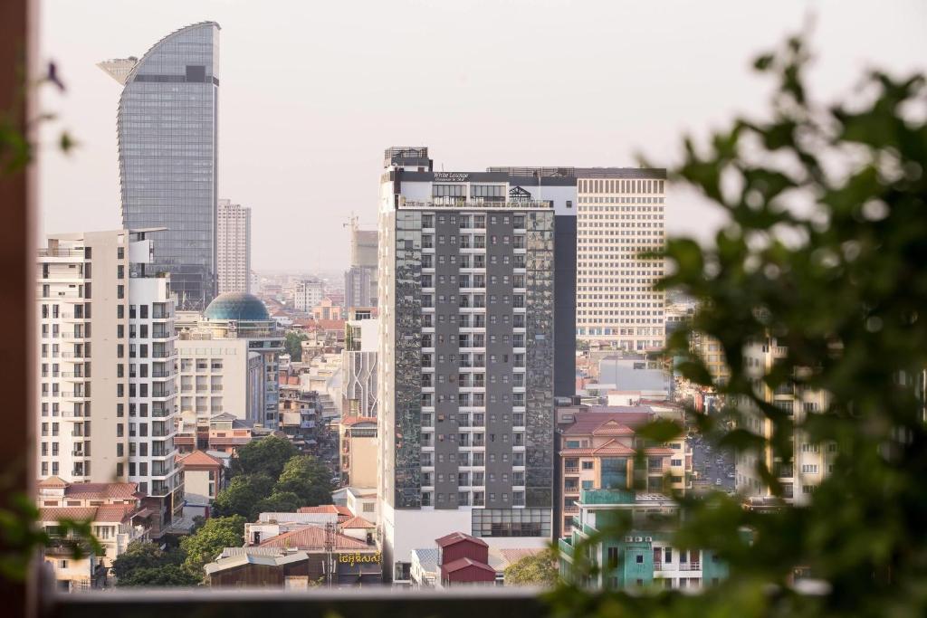 a view of a city with tall buildings at Poulo Wai Hotel, Trademark Collection by Wyndham in Phnom Penh