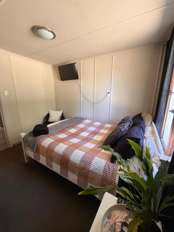 Ένα ή περισσότερα κρεβάτια σε δωμάτιο στο Cosy rural getaway