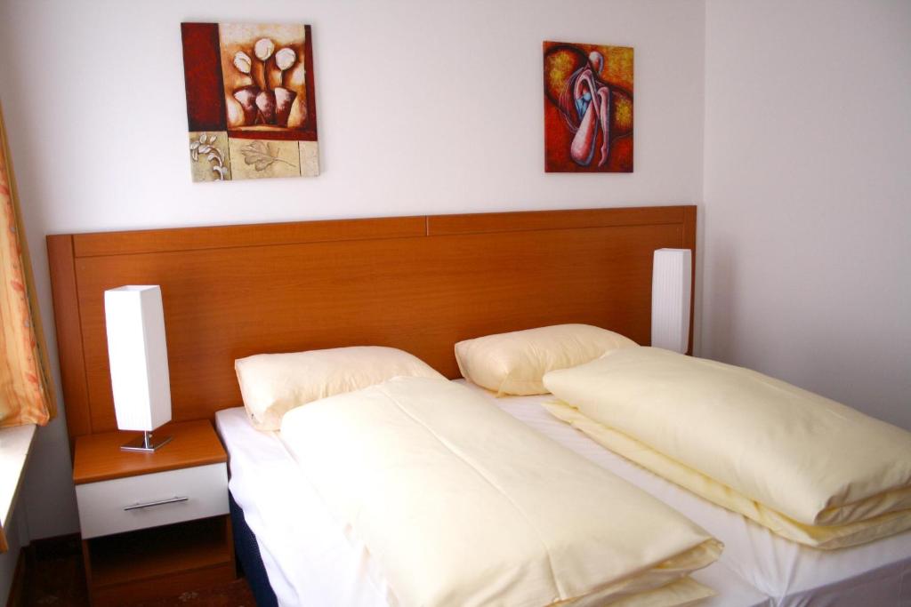 Postel nebo postele na pokoji v ubytování Hotel Evido Salzburg City Center