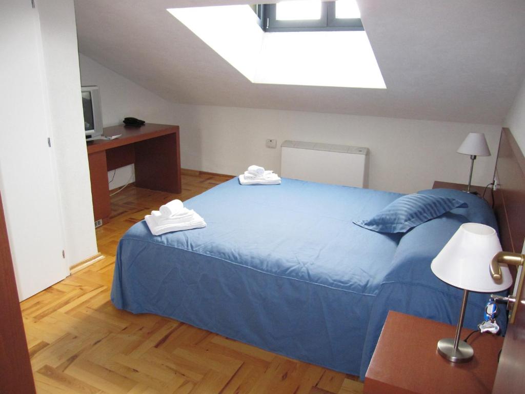 Postel nebo postele na pokoji v ubytování Hotel Park