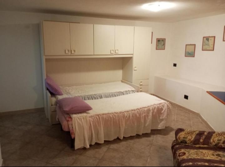 a bedroom with a bed and a couch at SA FraDa in Olmedo