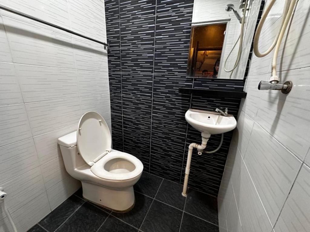 Koupelna v ubytování OYO 1181 Casa Leveria