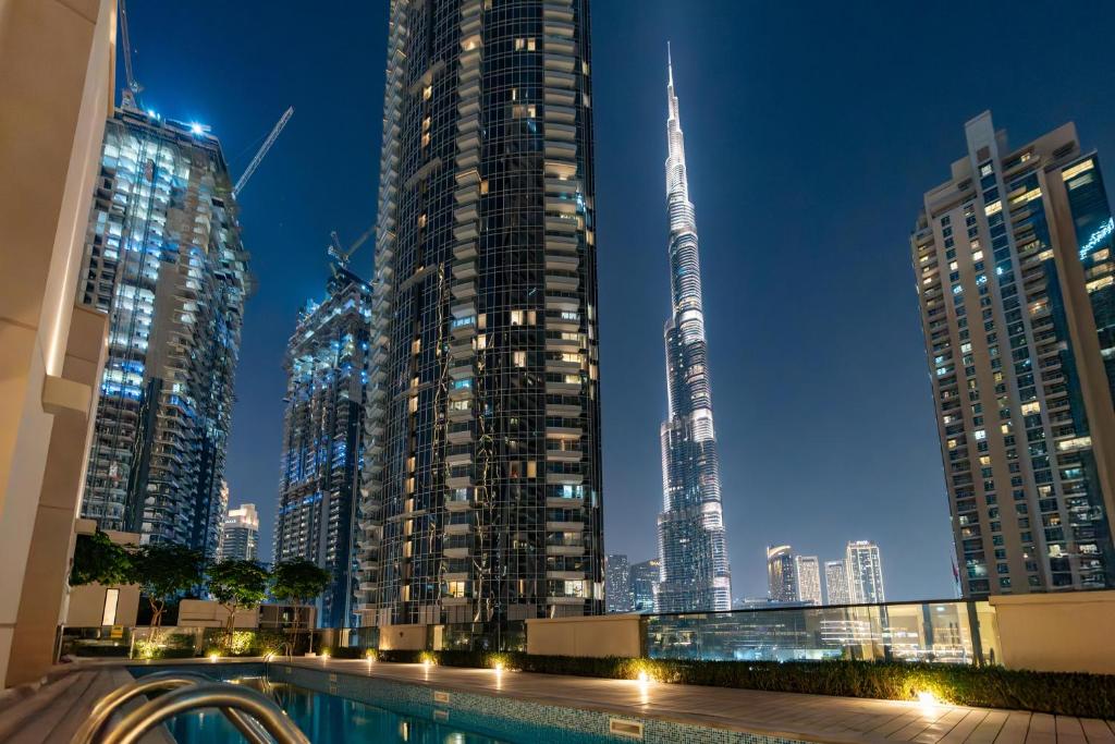 a view of a city skyline at night at Westminster ACT1 ACT2 in Dubai