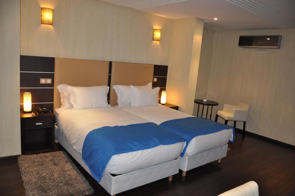 Postel nebo postele na pokoji v ubytování Hotel Emilio Moretti