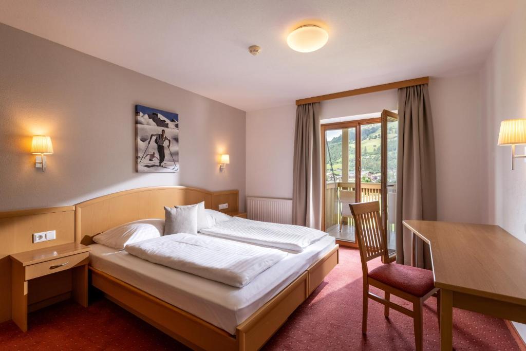 En eller flere senge i et værelse på Appartements Barbara