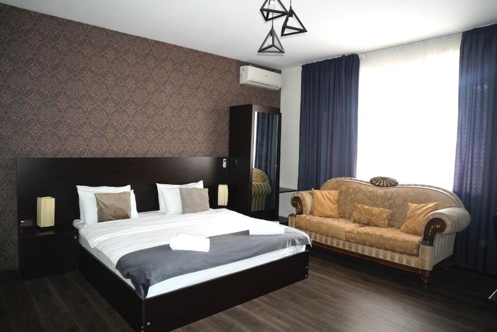 Postel nebo postele na pokoji v ubytování Hotel New Terrace