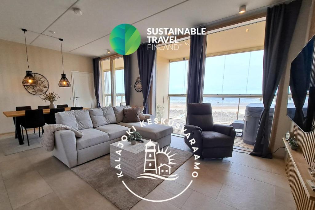 a living room with a couch and a table at Marina Resort A8 in Kalajoki