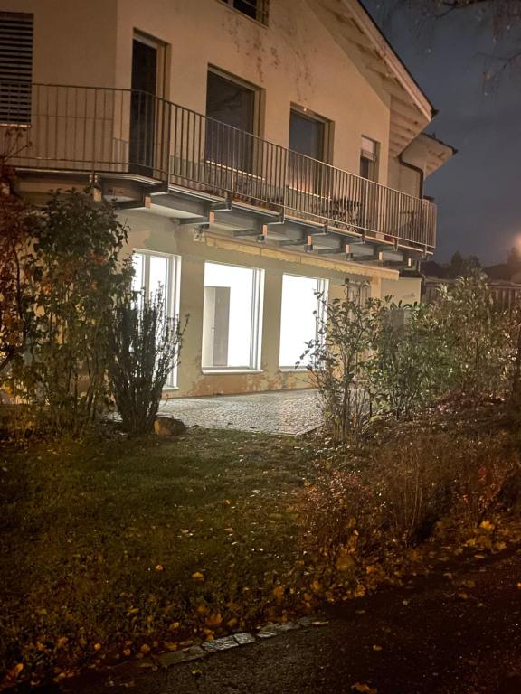 a house with a balcony on the side of it at Your exclusive holiday home in Winterthur