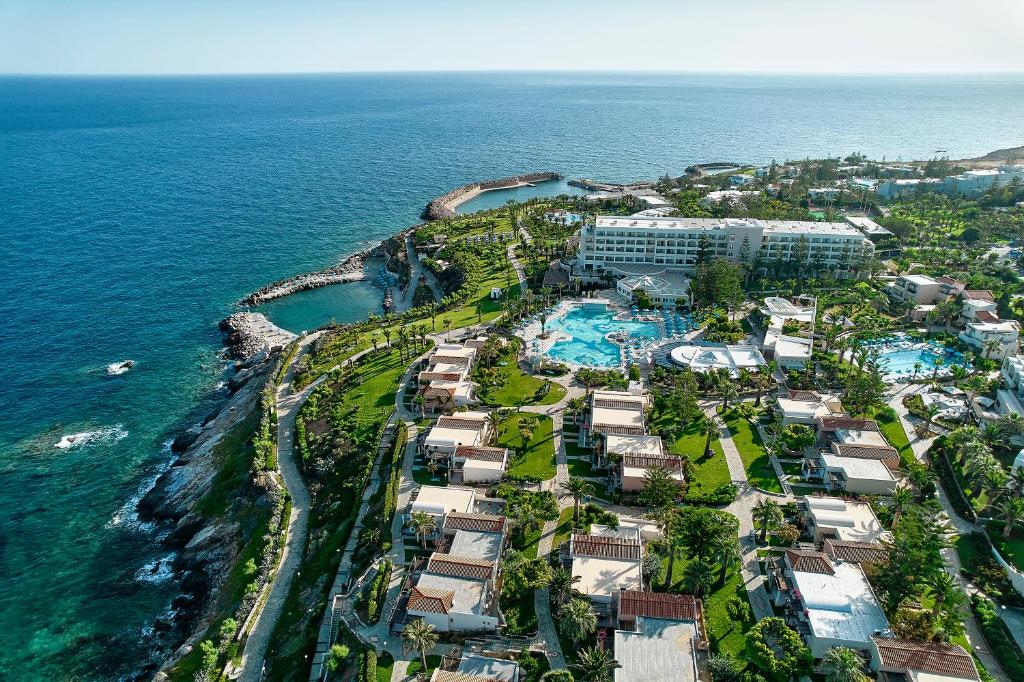 an aerial view of a resort next to the ocean at Iberostar Waves Creta Panorama & Mare in Panormos Rethymno