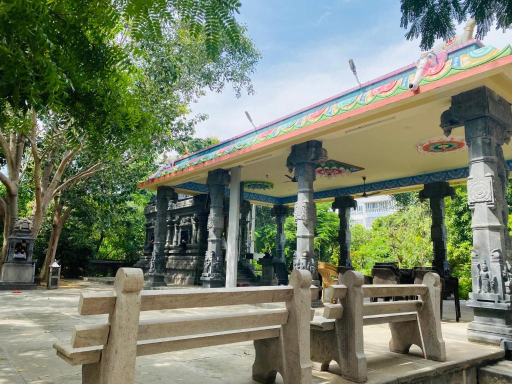 a bench in front of a bus stop at Ponni Delta Nature Stay by the River in Fort
