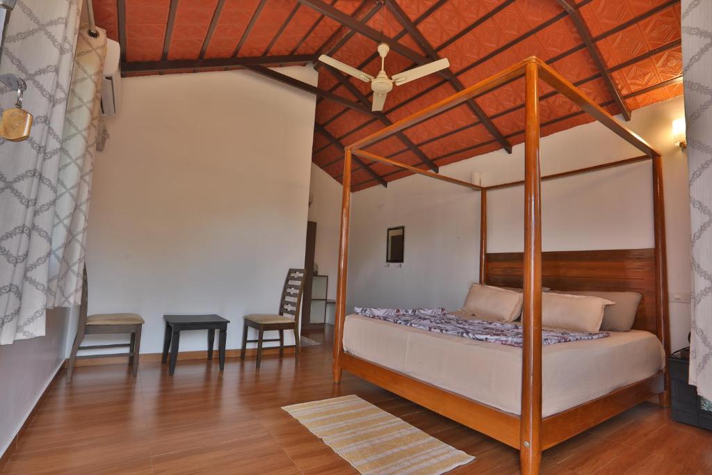 Postel nebo postele na pokoji v ubytování Gonakal Homestay