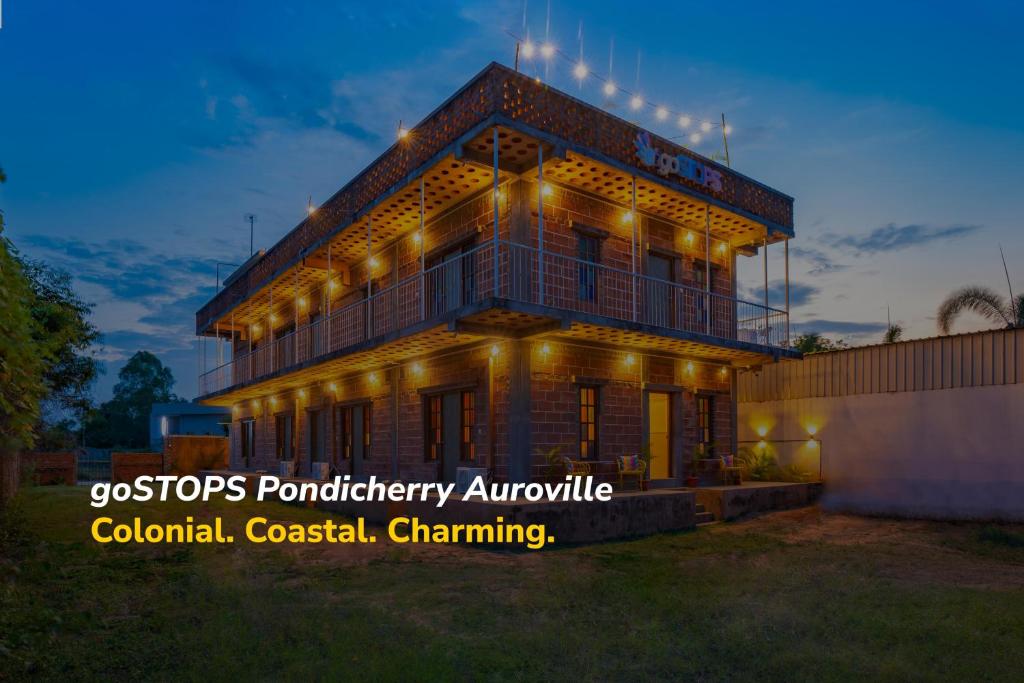 a house with lights on top of it at goSTOPS Pondicherry Near Auroville in Auroville