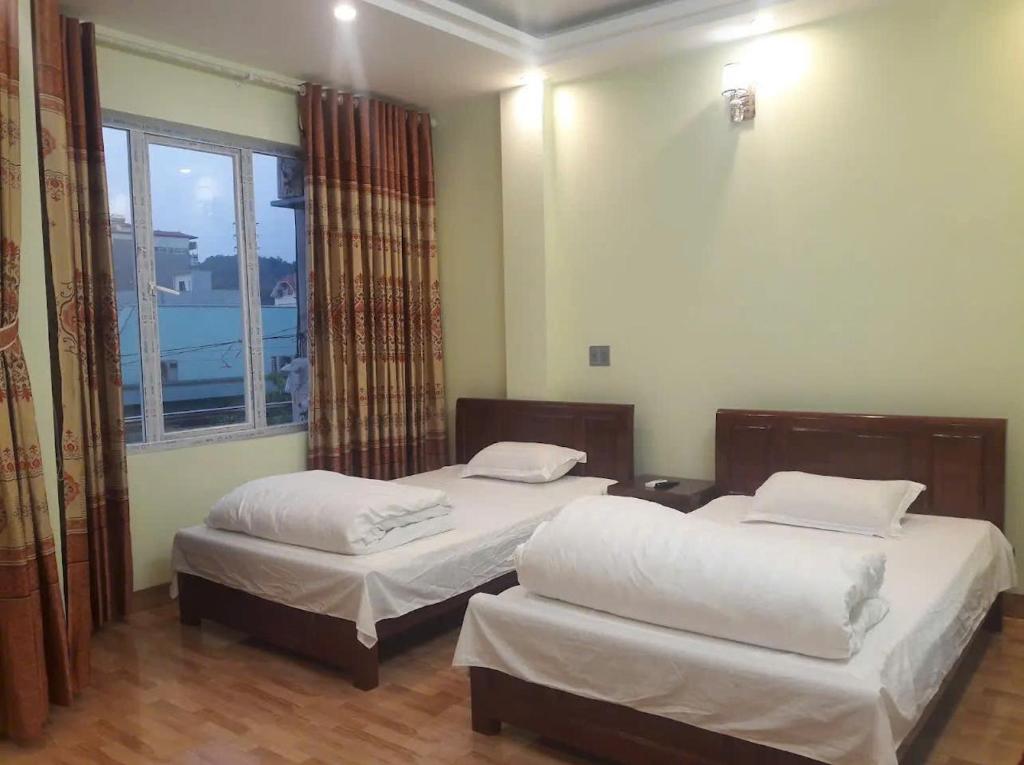 Postel nebo postele na pokoji v ubytování Nhà Nghỉ Hải Dũng