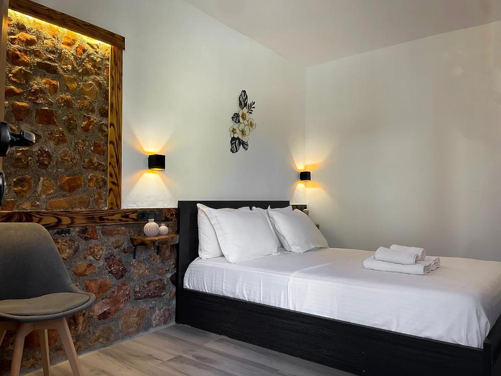 Postel nebo postele na pokoji v ubytování Archontiko Kantilis