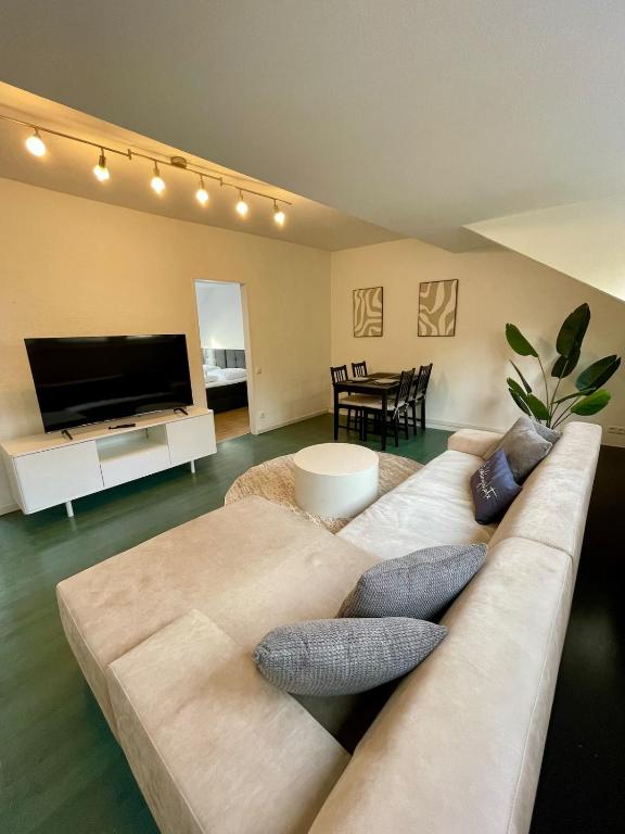 TV a/nebo společenská místnost v ubytování Apartment - Nähe CHIO Aachen