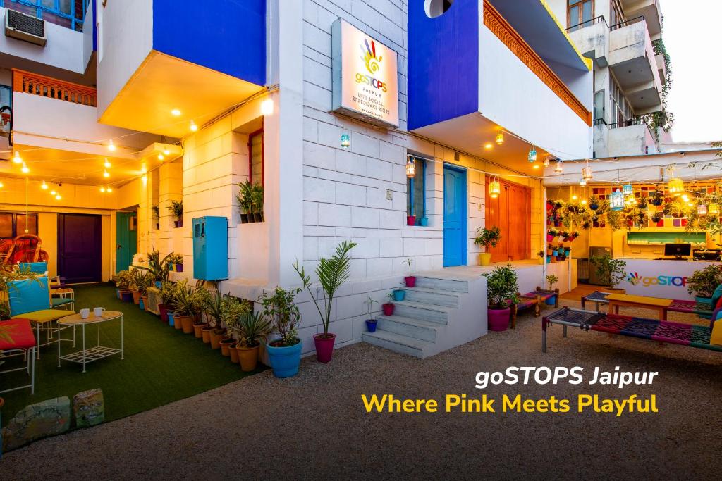 a building with a restaurant with plants in it at goSTOPS Lite Jaipur in Jaipur