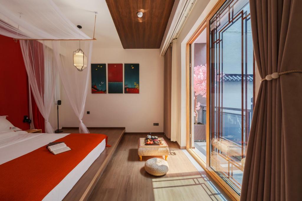 Ένα ή περισσότερα κρεβάτια σε δωμάτιο στο Datang Yin