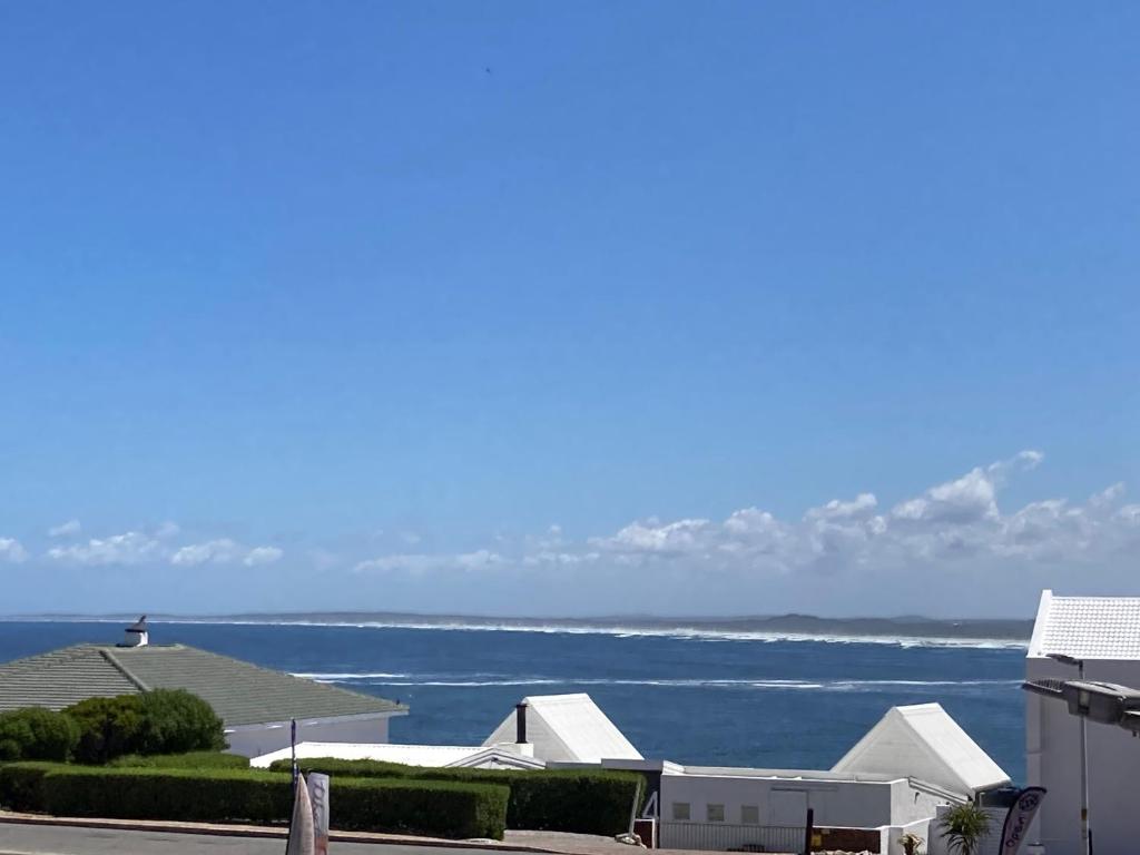 a view of the ocean from a house at The Villa On Fontana in Yzerfontein