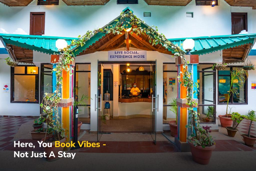 a store front with a sign that says here you book videos not just a stay at goSTOPS Mukteshwar in Mukteswar