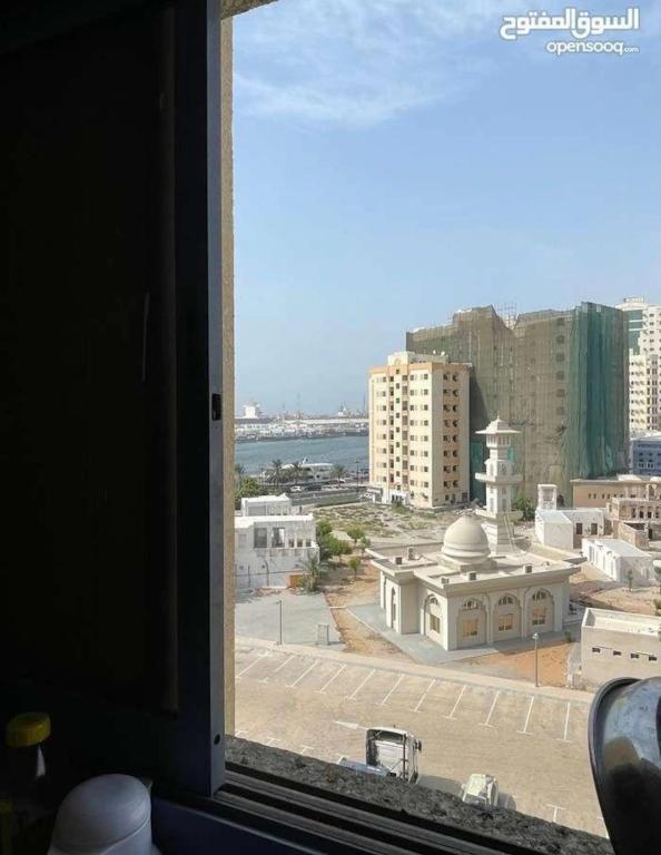 a view of a city from a window at Sharing flat for LADIES ONLY in Sharjah