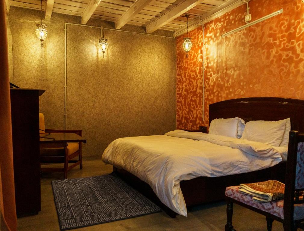 Ένα ή περισσότερα κρεβάτια σε δωμάτιο στο A Heritage Homestay-Aberfoyle Cottage