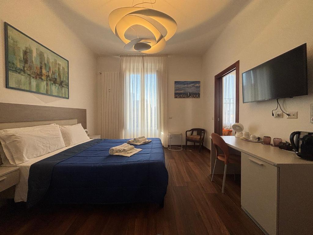 Postel nebo postele na pokoji v ubytování Enjoy Milano Skyline