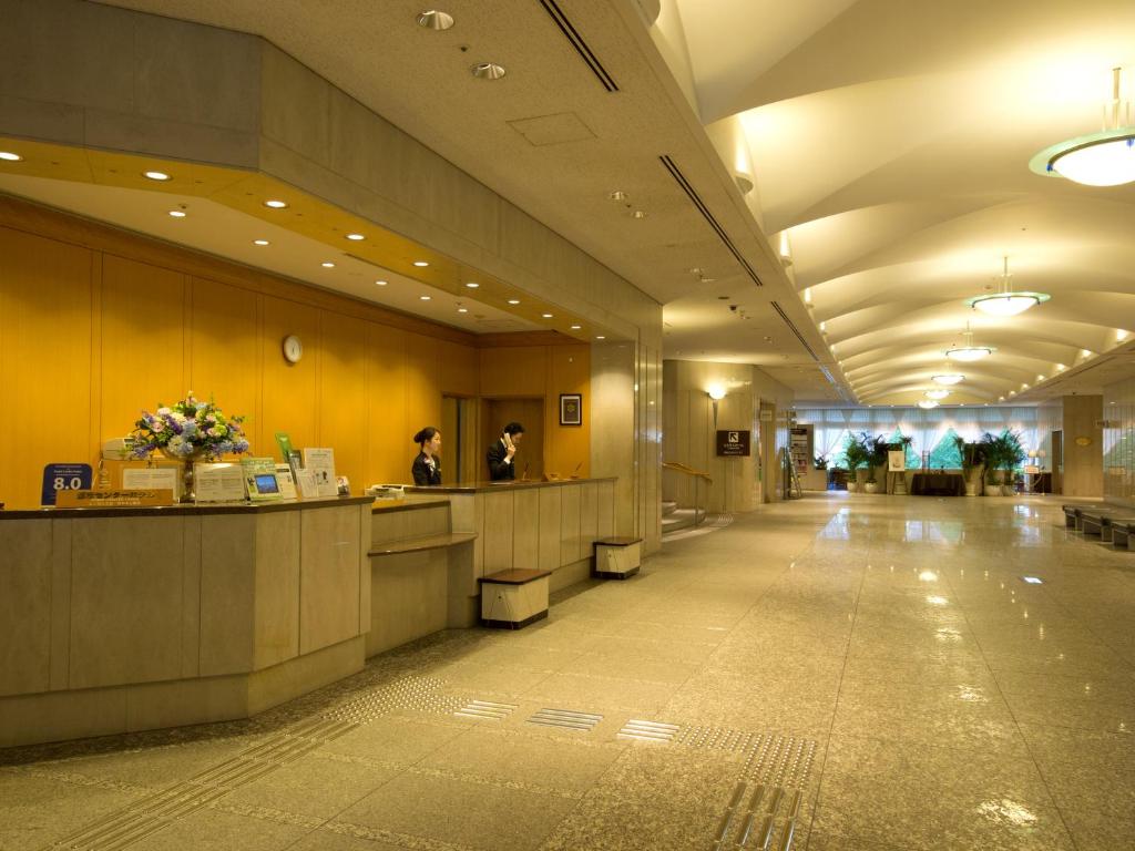 a lobby of a hotel with a reception desk at Toshi Center Hotel in Tokyo