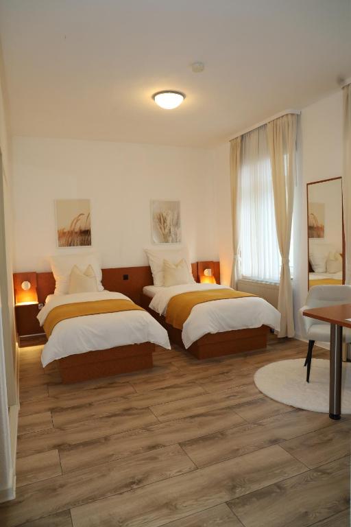 Postel nebo postele na pokoji v ubytování Hotel Mutter Buermann